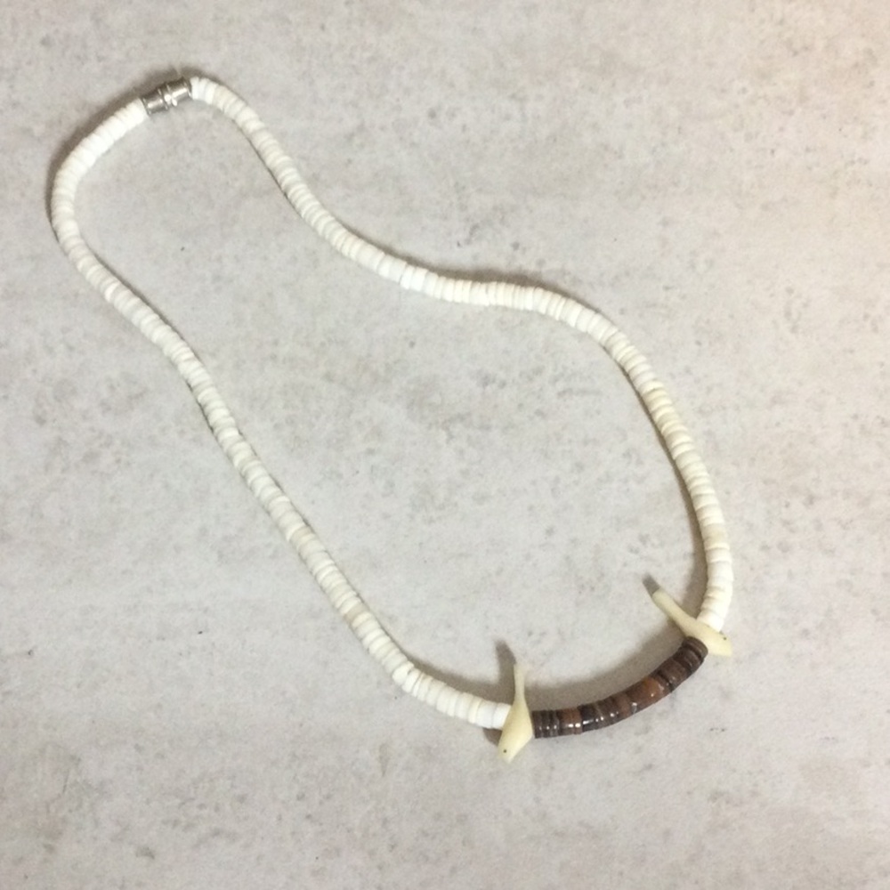 White and brown puka shell and ivory birds necklace
